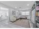 Cozy living room featuring L-shaped sofa, built-in shelving, and a large rug at 415 21St N St, St Petersburg, FL 33713