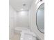 Updated bathroom with bathtub, single vanity, and marble tile at 4226 Elwood Rd, Spring Hill, FL 34609