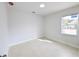 Bright bedroom with a window and wood-look tile floor at 4226 Elwood Rd, Spring Hill, FL 34609