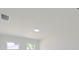 Bright bedroom with two windows and recessed lighting at 4226 Elwood Rd, Spring Hill, FL 34609