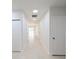 Bright hallway with tile flooring and access to other rooms at 4226 Elwood Rd, Spring Hill, FL 34609