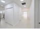 View down a hallway showcasing the kitchen and living area at 4226 Elwood Rd, Spring Hill, FL 34609