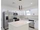 Modern kitchen with white cabinets, stainless steel appliances, and quartz countertops at 4226 Elwood Rd, Spring Hill, FL 34609
