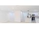 Open concept kitchen with white cabinets and stainless steel appliances at 4226 Elwood Rd, Spring Hill, FL 34609