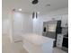 Modern kitchen with white cabinets, stainless steel appliances, and quartz countertops at 4226 Elwood Rd, Spring Hill, FL 34609