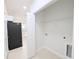 Laundry closet with shelving for storage at 4226 Elwood Rd, Spring Hill, FL 34609