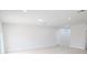 Bright and airy living room with tile flooring and access to hallway at 4226 Elwood Rd, Spring Hill, FL 34609
