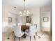 Formal dining room with a round table and chandelier at 4520 W Woodmere Rd, Tampa, FL 33609