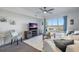 Comfortable living room with waterfront view, couch, and entertainment center at 4939 Floramar Ter # 501, New Port Richey, FL 34652