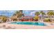 Community pool with gazebo and lounge chairs at 4939 Floramar Ter # 501, New Port Richey, FL 34652