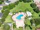 Aerial view of community pool, tennis court, and surrounding landscape at 529 Vista Ridge Dr, Ruskin, FL 33570