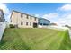 Large backyard with a grassy lawn and white fence at 529 Vista Ridge Dr, Ruskin, FL 33570
