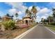 Entrance to Mira Lago community with palm trees at 529 Vista Ridge Dr, Ruskin, FL 33570