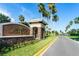 Entrance to Mira Lago community with palm trees at 529 Vista Ridge Dr, Ruskin, FL 33570