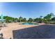 Community pool with lounge chairs and umbrellas at 529 Vista Ridge Dr, Ruskin, FL 33570