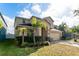 Two-story house with tan exterior, landscaping, and a two-car garage at 529 Vista Ridge Dr, Ruskin, FL 33570