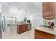 Open kitchen features island, stainless steel appliances, and granite countertops at 529 Vista Ridge Dr, Ruskin, FL 33570