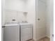 Laundry room with washer, dryer, and shelving at 529 Vista Ridge Dr, Ruskin, FL 33570