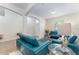 Living room with teal couches and a glass coffee table at 529 Vista Ridge Dr, Ruskin, FL 33570