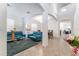 Bright living room with teal couches and a glass coffee table at 529 Vista Ridge Dr, Ruskin, FL 33570