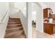 Staircase leading to upper level with kitchen view at 529 Vista Ridge Dr, Ruskin, FL 33570