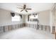 Bedroom undergoing renovations, showing exposed framing and new flooring at 6951 S Shore S Dr, South Pasadena, FL 33707