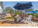 Deck with fire pit, seating, and grill in backyard at 826 53Rd N Ter, St Petersburg, FL 33703