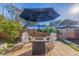 Deck with fire pit and seating area under an umbrella at 826 53Rd N Ter, St Petersburg, FL 33703