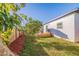 Spacious backyard with deck, grass, and wooden fence at 826 53Rd N Ter, St Petersburg, FL 33703