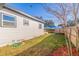Side yard with grassy area and wooden fence at 826 53Rd N Ter, St Petersburg, FL 33703