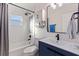 Renovated bathroom with subway tile, modern vanity, and updated fixtures at 826 53Rd N Ter, St Petersburg, FL 33703