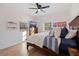 Bright bedroom with wood floors, and a wooden bed frame at 826 53Rd N Ter, St Petersburg, FL 33703