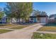 Front view of house with driveway and landscaping at 826 53Rd N Ter, St Petersburg, FL 33703