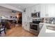 Modern kitchen with stainless steel appliances and open to living area at 826 53Rd N Ter, St Petersburg, FL 33703