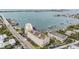 Aerial view of a waterfront building complex with parking and boat access at 100 Bluff View Dr # 602A, Belleair Bluffs, FL 33770