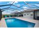 Inviting screened-in pool and patio with seating area perfect for outdoor gatherings and relaxation under a bright sky at 11312 Gallatin Trl, Parrish, FL 34219