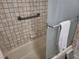 Bathroom with shower/tub and tiled walls at 1270 Gulf Blvd # 1102, Clearwater Beach, FL 33767