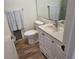 Clean bathroom with white vanity and updated flooring at 1270 Gulf Blvd # 1102, Clearwater Beach, FL 33767