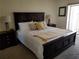 Bright bedroom featuring a king-size bed and two nightstands at 1270 Gulf Blvd # 1102, Clearwater Beach, FL 33767