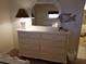 Bedroom with dresser and large mirror at 1270 Gulf Blvd # 1102, Clearwater Beach, FL 33767