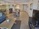 Bright dining area with table and chairs, open to living room and kitchen at 1270 Gulf Blvd # 1102, Clearwater Beach, FL 33767