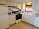 Clean and efficient kitchen with white cabinets and appliances at 1270 Gulf Blvd # 1102, Clearwater Beach, FL 33767