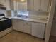 Kitchen with white cabinets, a dishwasher, and a stove at 1270 Gulf Blvd # 1102, Clearwater Beach, FL 33767