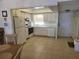 Full kitchen with white cabinets and appliances at 1270 Gulf Blvd # 1102, Clearwater Beach, FL 33767