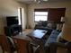 Bright living room with comfy seating and a large TV at 1270 Gulf Blvd # 1102, Clearwater Beach, FL 33767
