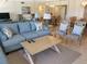 Spacious living room with comfortable sofas and coffee table at 1270 Gulf Blvd # 1102, Clearwater Beach, FL 33767