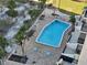 Community pool with surrounding patio area at 1270 Gulf Blvd # 1102, Clearwater Beach, FL 33767