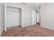 Bedroom with carpet, closet, and access to a hallway at 13419 Lake Monroe Pl, Riverview, FL 33579