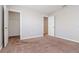 Bright bedroom with carpet flooring, closet, and access to other rooms at 13419 Lake Monroe Pl, Riverview, FL 33579