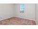 Simple bedroom with carpet flooring and a window at 13419 Lake Monroe Pl, Riverview, FL 33579